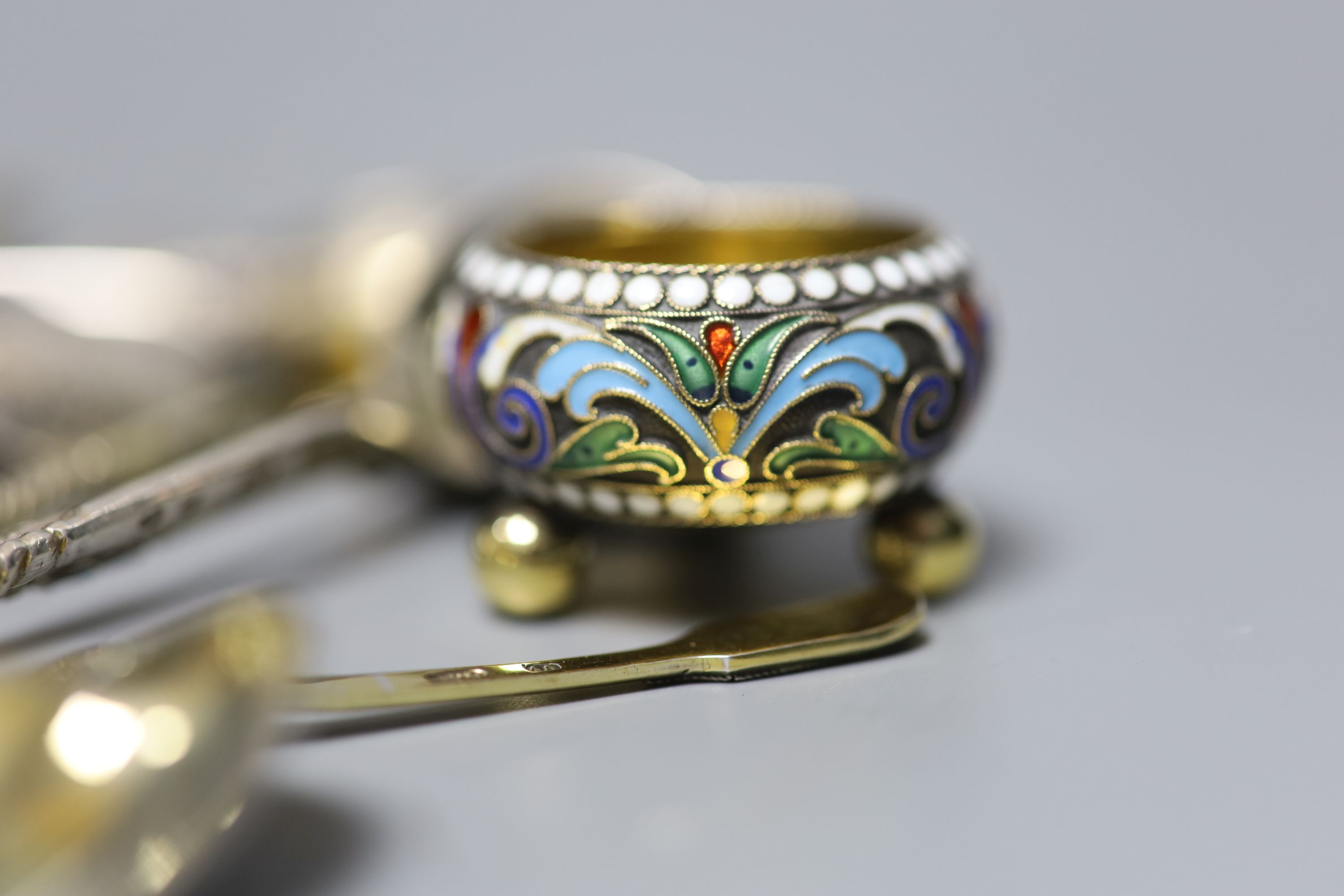 A small collection of Russian and Russian style white metal spoons etc, some with enamel or niello decoration.
